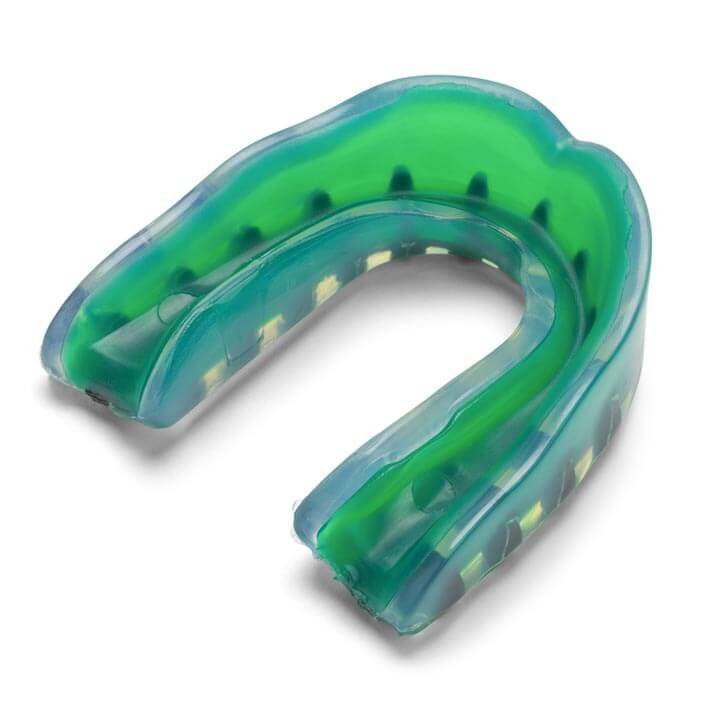 a green-blue mouthguard sitting on a white background